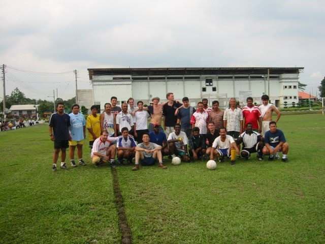 The whole group posed on a football pitch at GAMMA 2001