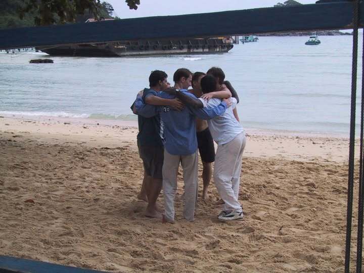 A group hug on the beach